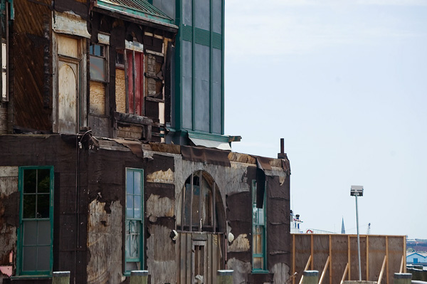 Plywood is the dominant theme on a wharf building.