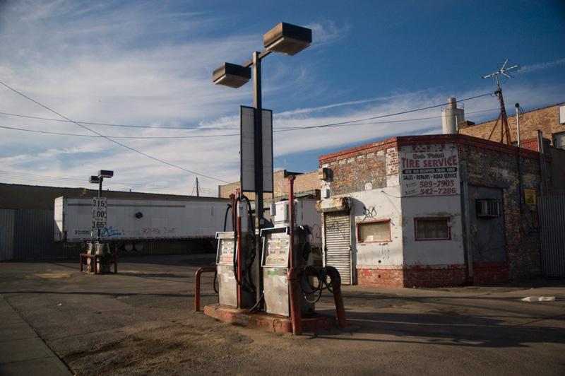Idle gas pumps and a closed office at a gasoline service station.