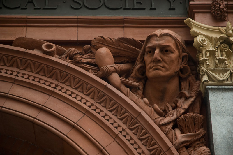 The sculpted face of a Native American.